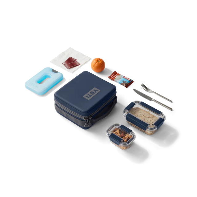 Yeti Daytrip 3L Lunch Box in Navy surrounded by lunch goods