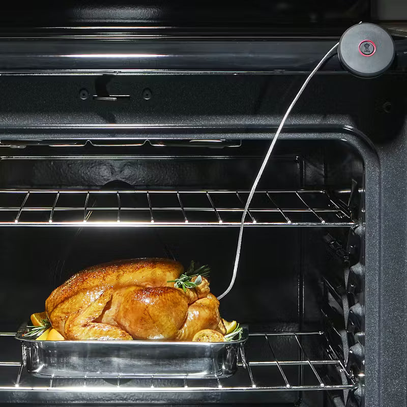 Weber Smart Probe attached to oven while poked inside whole chicken